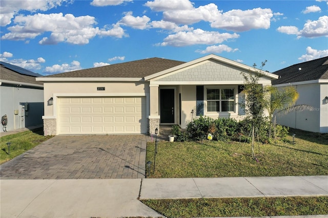 view of front facade featuring a garage and a front lawn