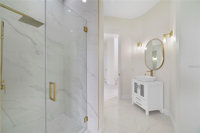 bathroom featuring vanity and a shower with shower door