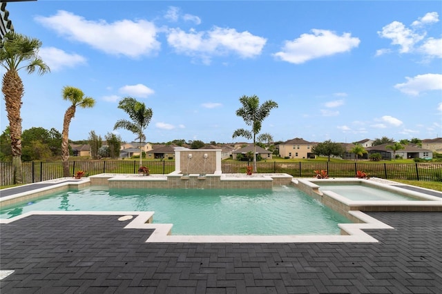 view of pool featuring an in ground hot tub