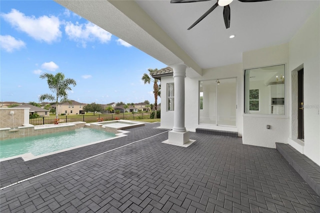 view of pool featuring a patio area, ceiling fan, and pool water feature