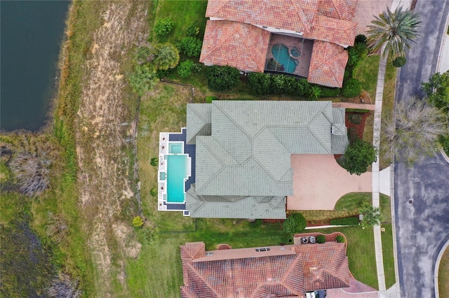 birds eye view of property with a water view