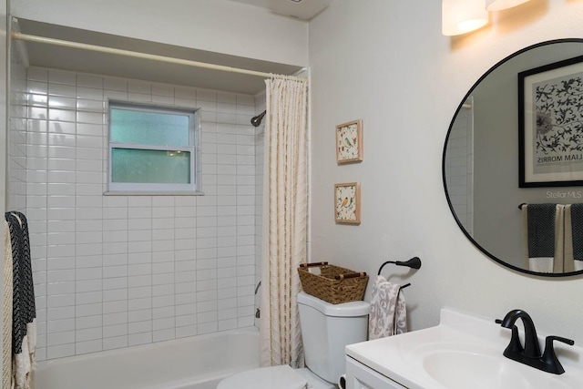 full bathroom featuring vanity, shower / bath combination with curtain, and toilet