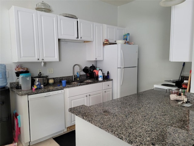 kitchen featuring white cabinets, white appliances, and sink