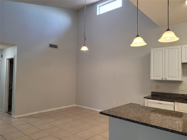 155 N Pearl Lake Cswy Unit 200, Altamonte Springs, FL 32714 - kitchen with high vaulted ceiling, white dishwasher, light tile patterned floors, white cabinetry, and pendant lighting