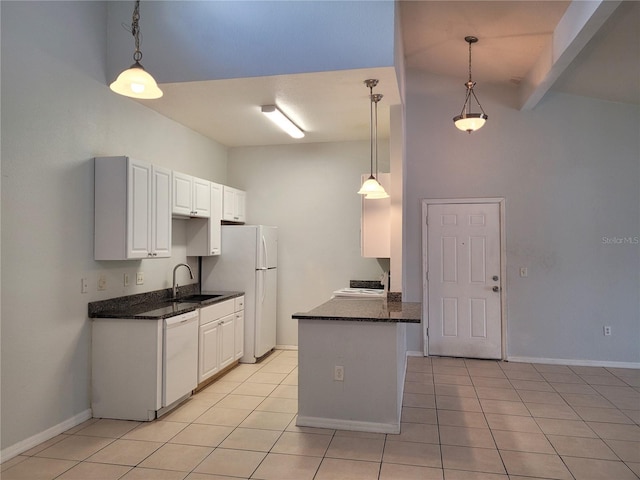 155 N Pearl Lake Cswy Unit 200, Altamonte Springs, FL 32714 - kitchen with white appliances, light tile patterned floors, a towering ceiling, a peninsula, and white cabinets