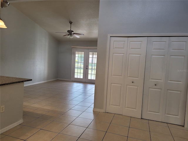 155 N Pearl Lake Cswy Unit 200, Altamonte Springs, FL 32714 - unfurnished living room with a ceiling fan, light tile patterned flooring, french doors, and a textured ceiling