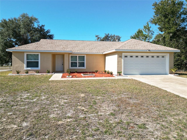 single story home featuring a front lawn and a garage