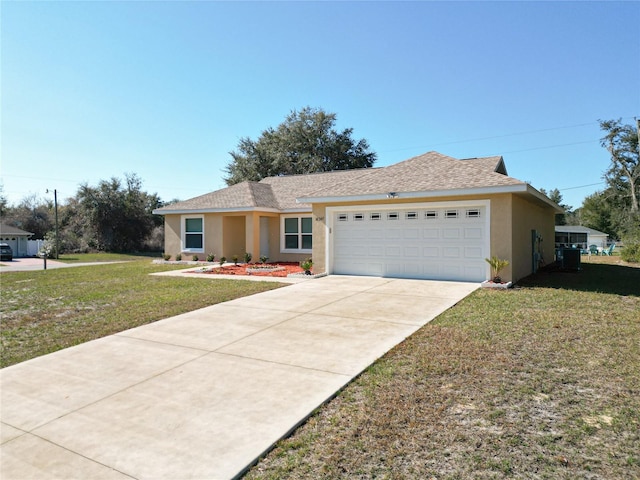 ranch-style home with a garage and a front lawn