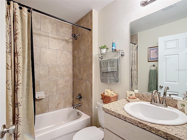 full bathroom with a textured ceiling, shower / tub combo with curtain, vanity, and toilet