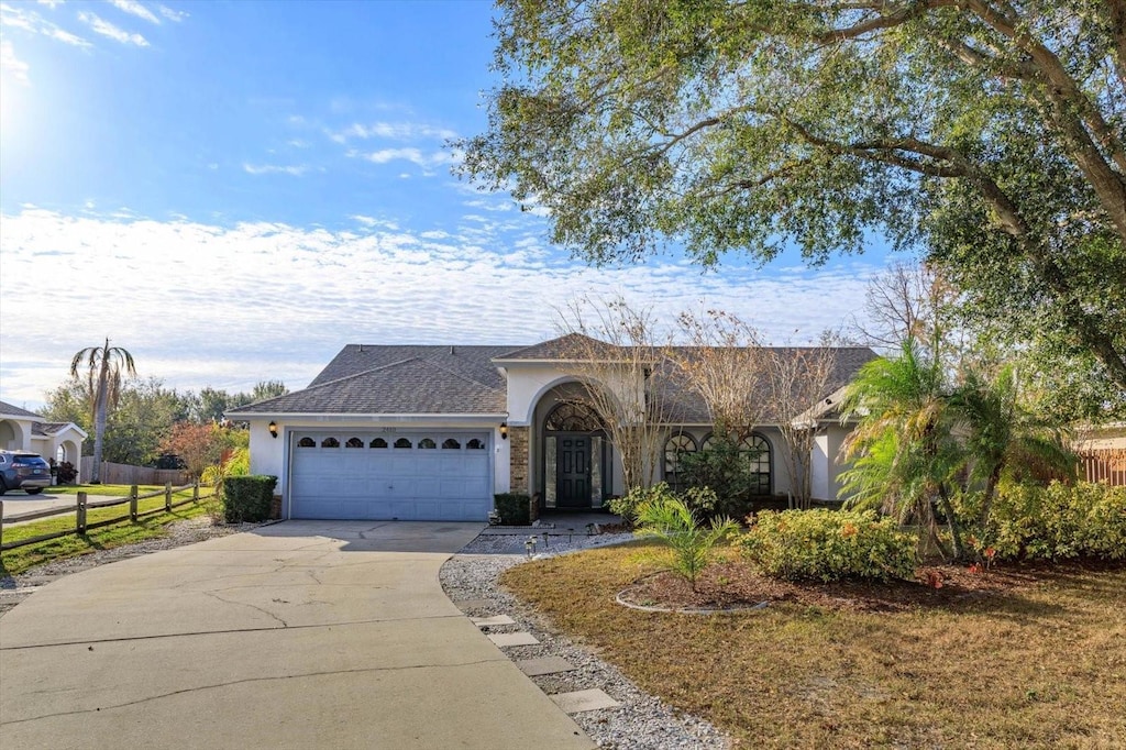 single story home featuring a garage