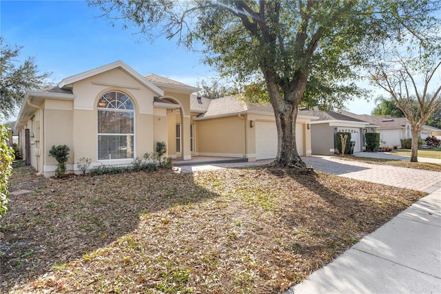 ranch-style home featuring a garage