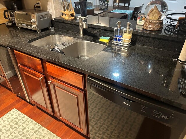 kitchen featuring sink, hardwood / wood-style flooring, and dishwasher