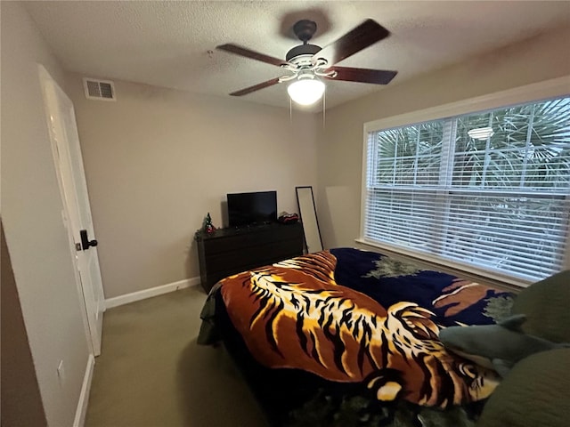 bedroom featuring ceiling fan and light colored carpet