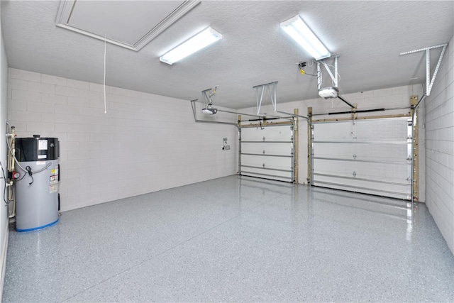 garage featuring a garage door opener and water heater