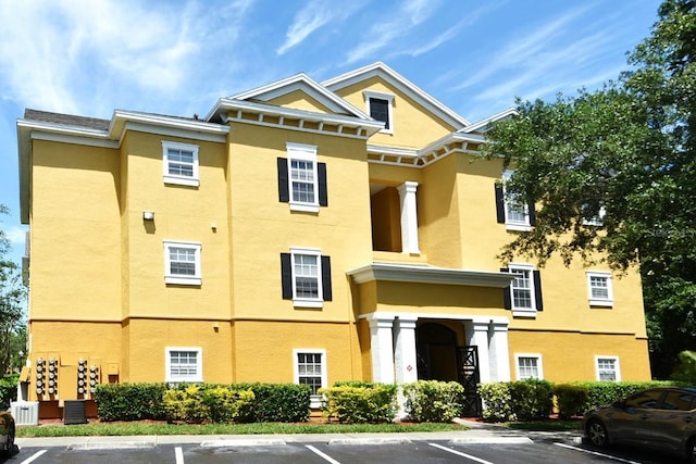 view of property featuring central AC unit