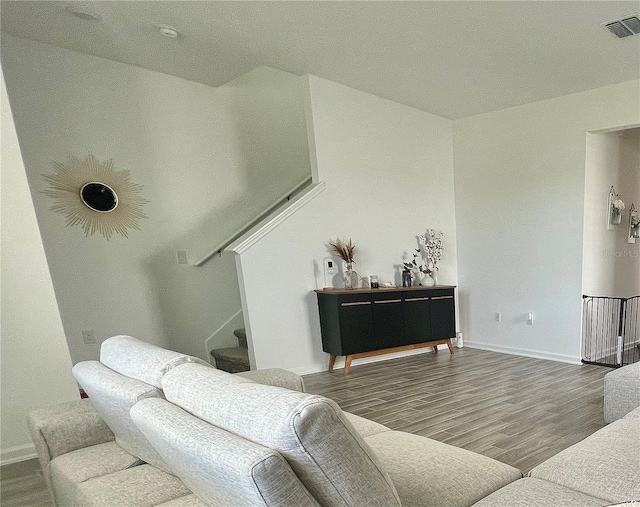 living room with dark hardwood / wood-style flooring