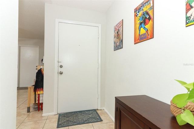 doorway with light tile patterned floors