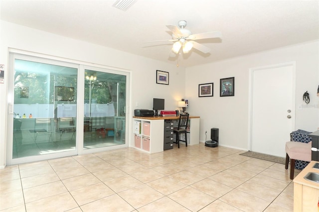 tiled office space with ceiling fan