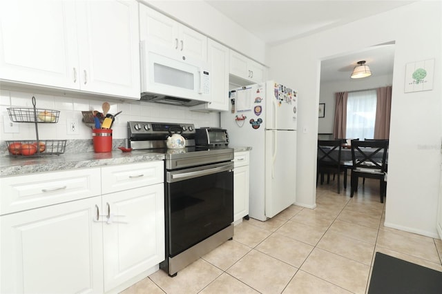 kitchen featuring white cabinetry, white appliances, backsplash, and light tile patterned floors