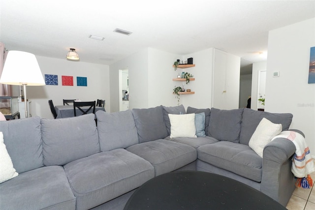 living room with light tile patterned flooring