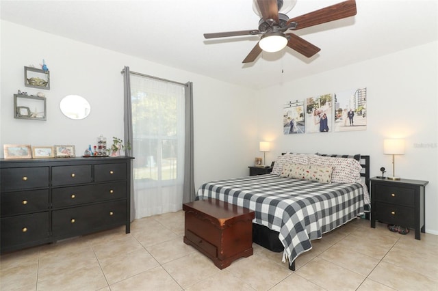 tiled bedroom with ceiling fan