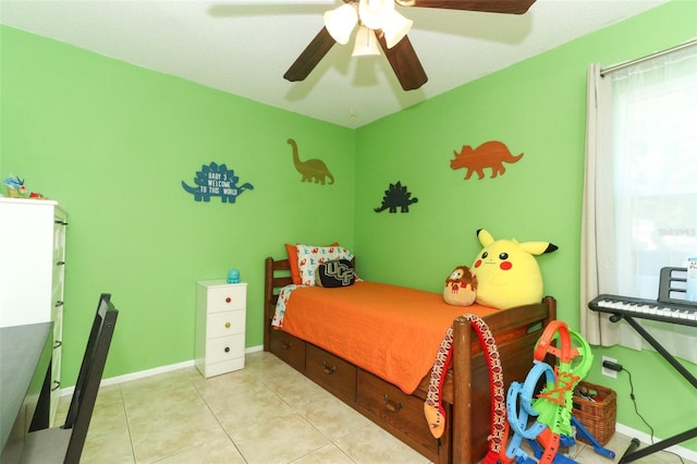 bedroom with ceiling fan and light tile patterned flooring