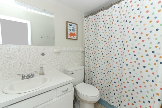 bathroom with vanity, a shower with shower curtain, toilet, tile walls, and tasteful backsplash