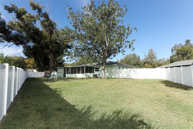 view of yard with a sunroom