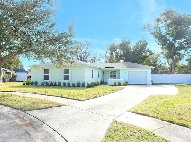 ranch-style house with a garage and a front lawn