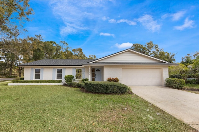 ranch-style home featuring a front lawn and a garage