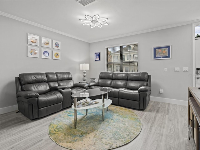 living room featuring ornamental molding and light hardwood / wood-style flooring