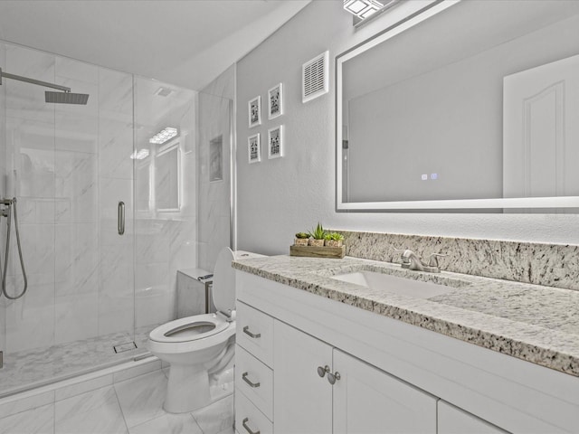 bathroom with a shower with door, toilet, and vanity