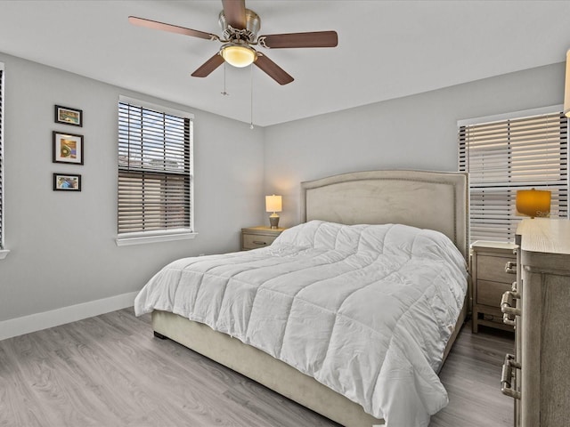 bedroom featuring ceiling fan and hardwood / wood-style flooring