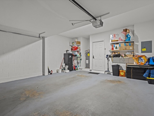 garage featuring electric panel, water heater, and a garage door opener