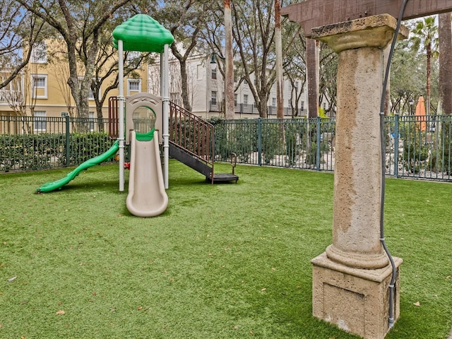 view of playground featuring a lawn