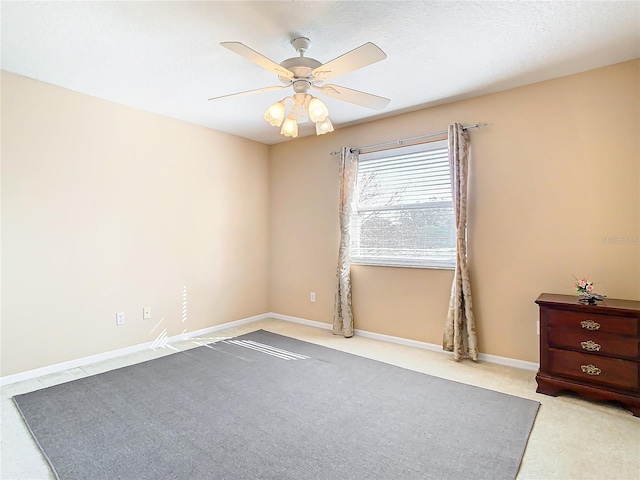 unfurnished room with ceiling fan