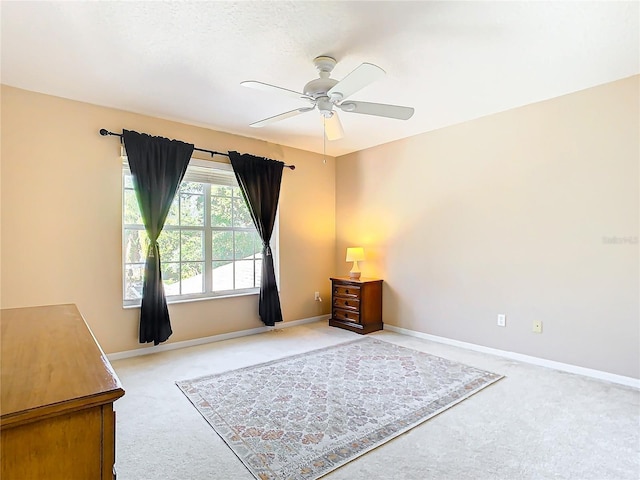 interior space featuring ceiling fan