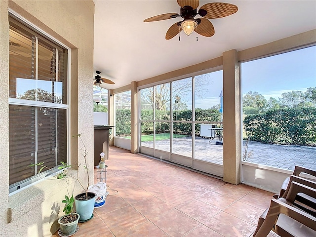 sunroom / solarium with ceiling fan and plenty of natural light