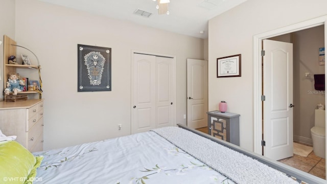 bedroom with ceiling fan and a closet