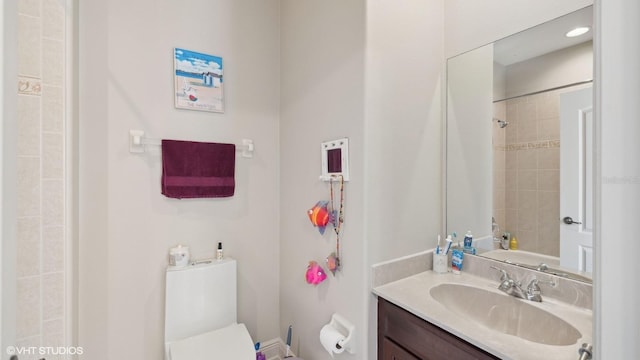 bathroom featuring vanity and toilet