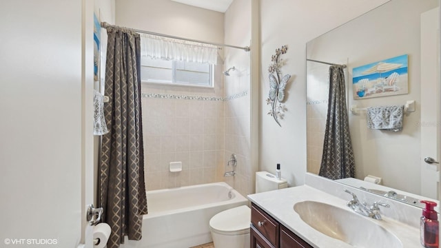 full bathroom with shower / bath combo, vanity, and toilet