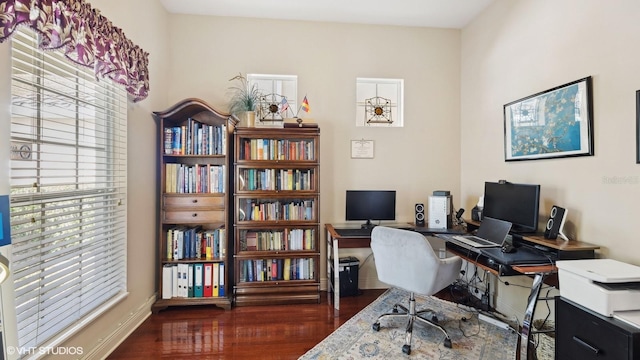 office with dark wood-type flooring