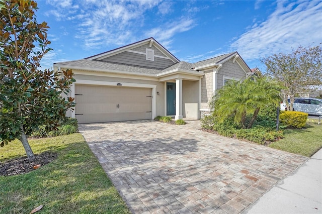 view of front of property with a garage