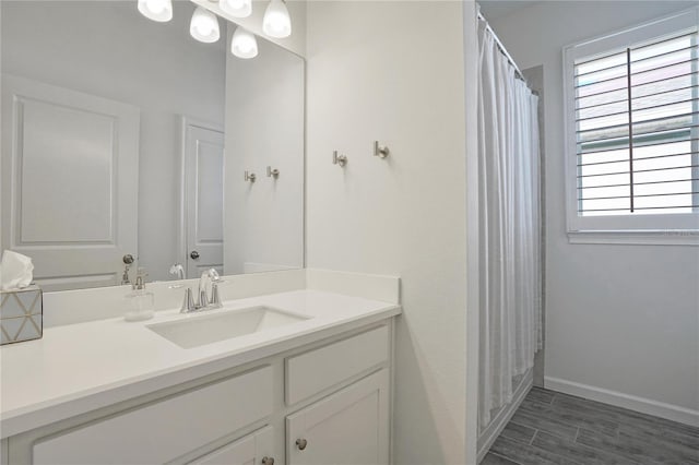 bathroom featuring a shower with shower curtain and vanity