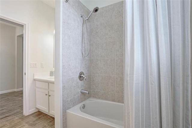 bathroom with shower / bath combination with curtain and vanity