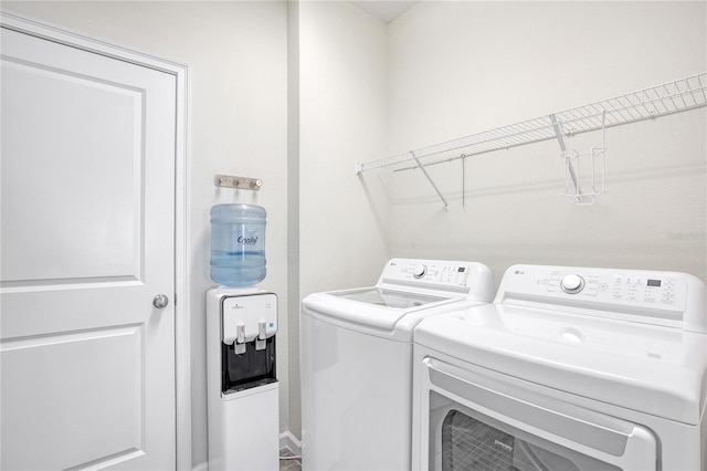 clothes washing area with independent washer and dryer