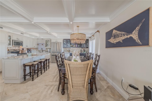 tiled dining room featuring sink, coffered ceiling, beamed ceiling, a notable chandelier, and crown molding