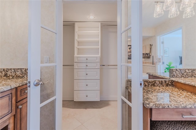 bathroom with tile patterned flooring and vanity