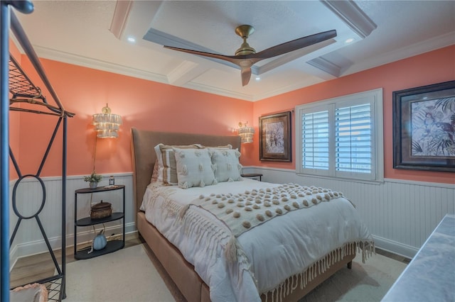 bedroom with ceiling fan, beam ceiling, and ornamental molding