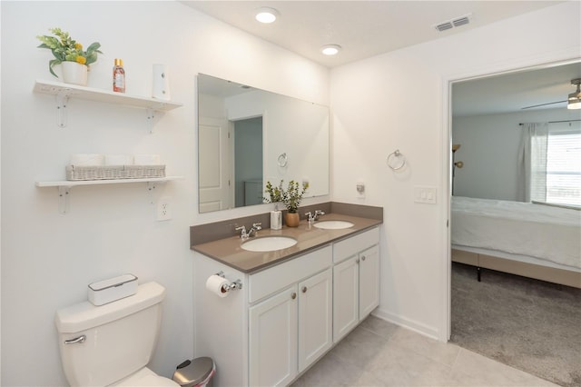 bathroom featuring ceiling fan, tile patterned flooring, vanity, and toilet